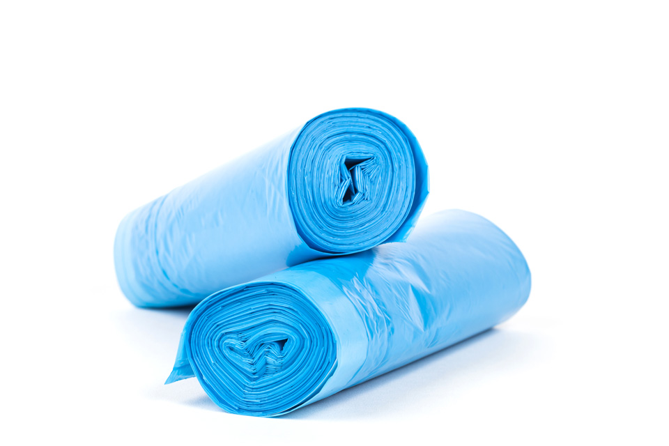 Rolls of disposable trash bags isolated on white background.